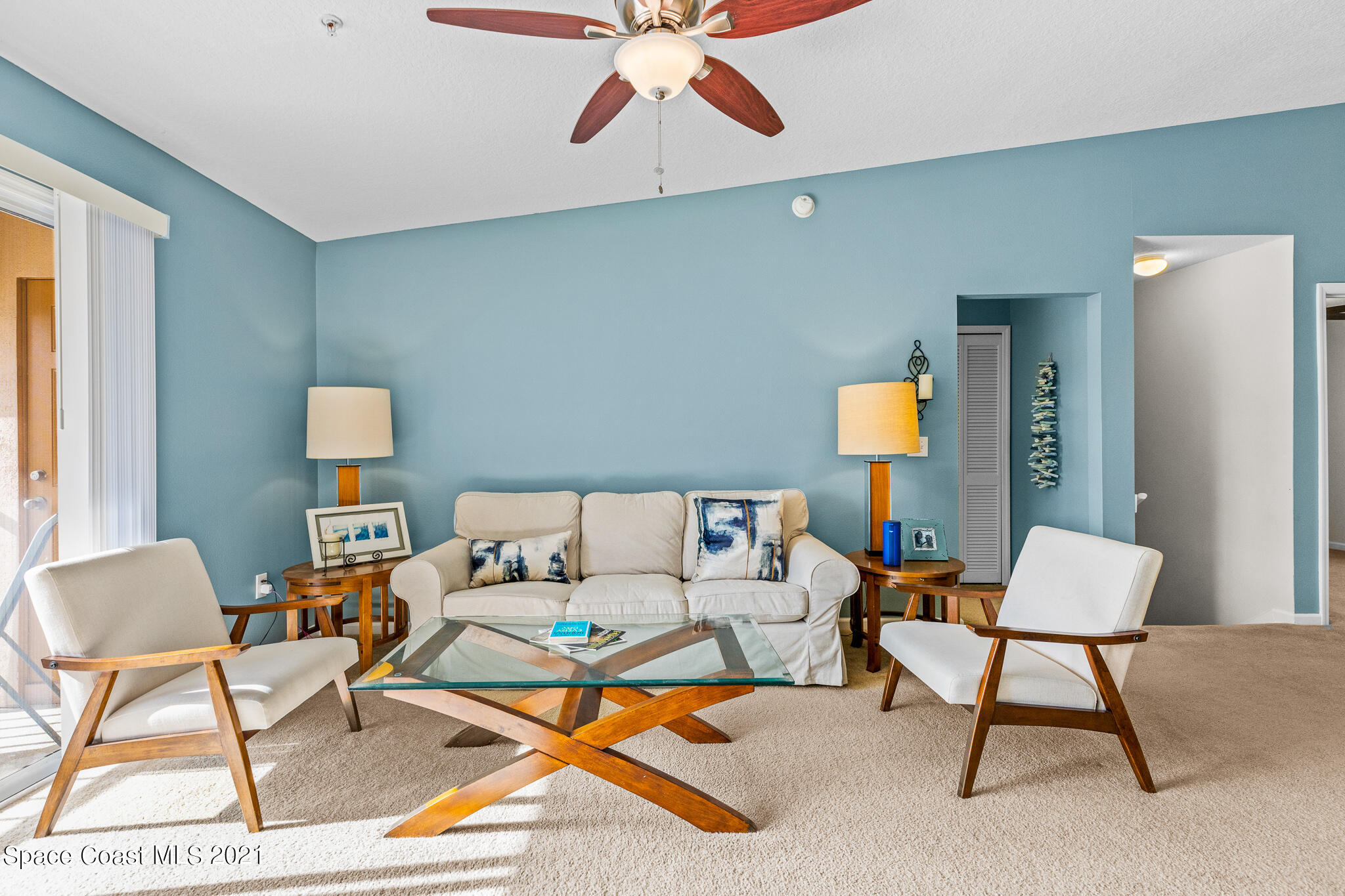 4056 Meander Place, Unit 201 Rockledge, FL 32955 - Photo 15 of 27 a living room with furniture and a lamp