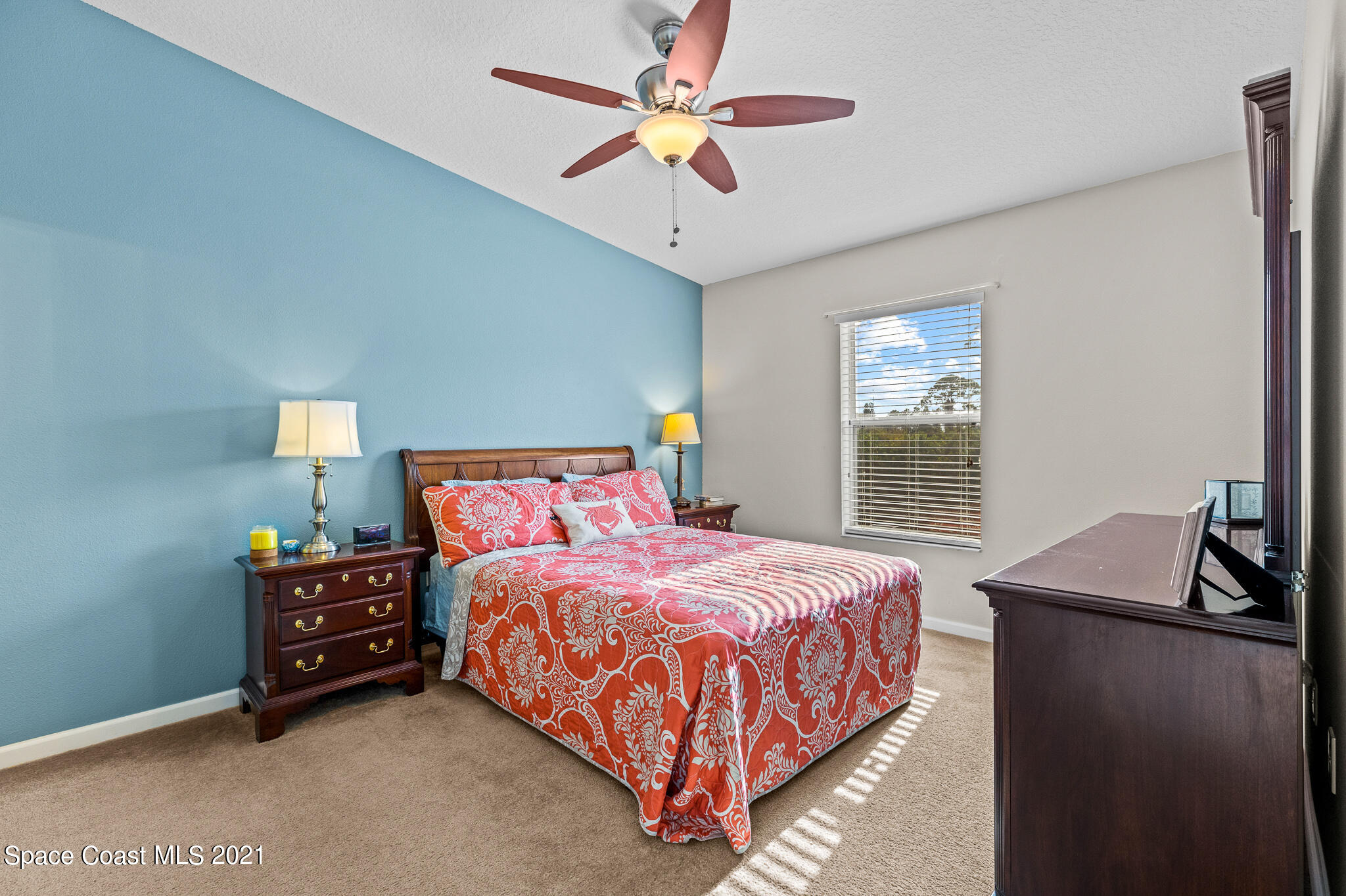 4056 Meander Place, Unit 201 Rockledge, FL 32955 - Photo 17 of 27 a bedroom with a bed and a chandelier