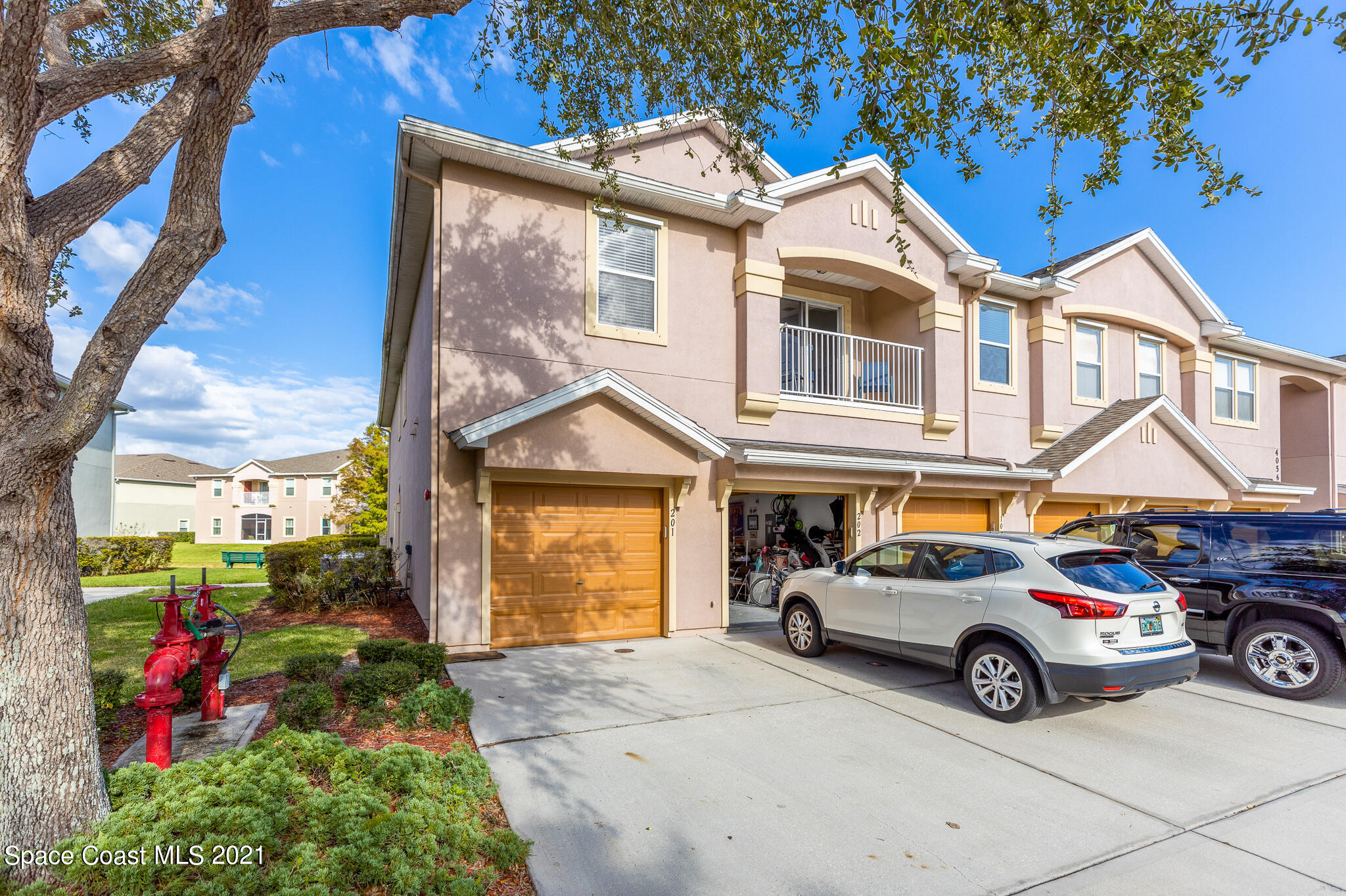 4056 Meander Place, Unit 201 Rockledge, FL 32955 - Photo 22 of 27 a car parked in front of a house
