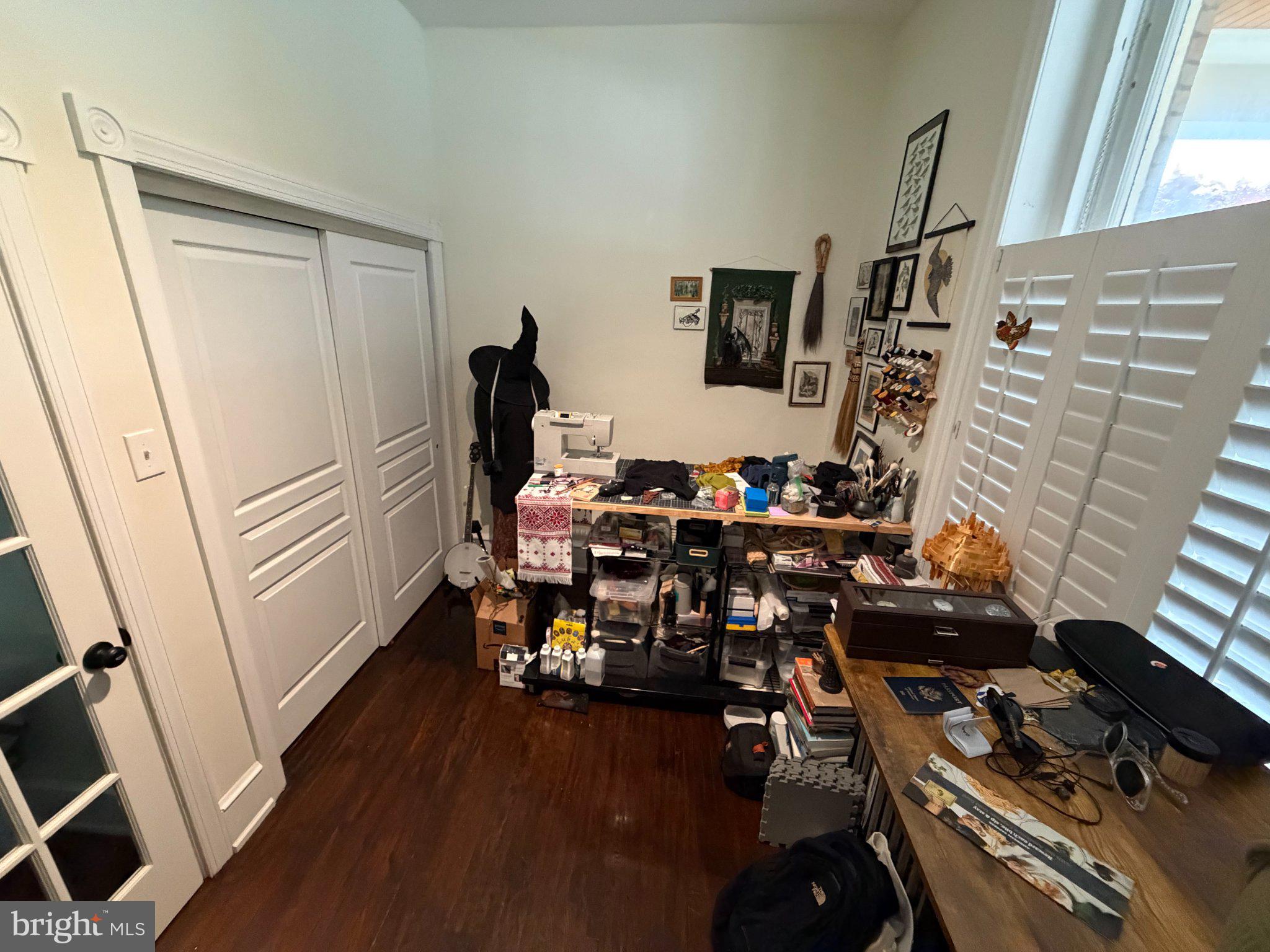 815 South 49th Street Philadelphia, PA 19143 - Photo 6 of 72 a view of a workspace with furniture and wooden floor