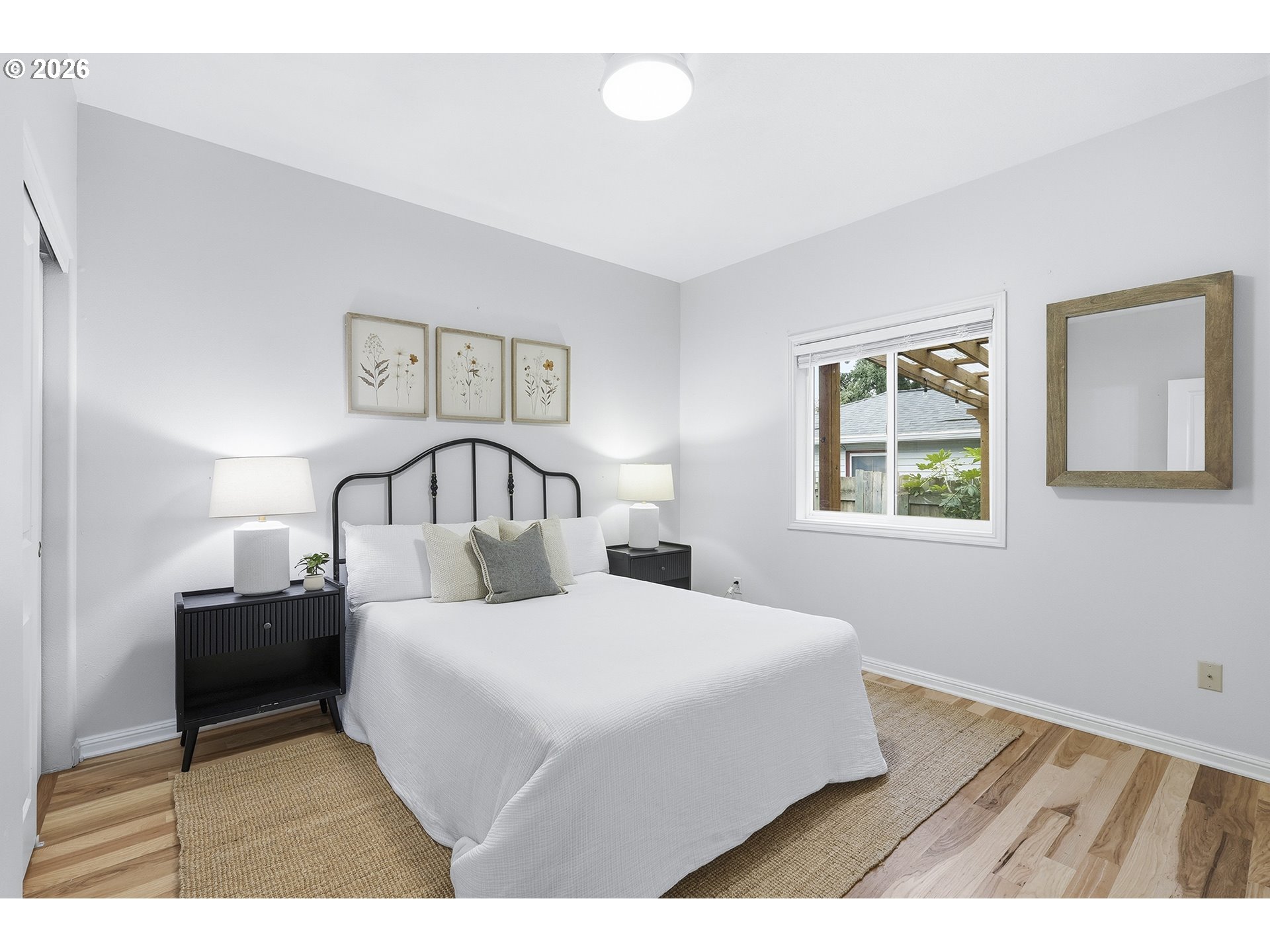 3307 North Terry Street Portland, OR 97217 - Photo 20 of 37 a bedroom with a bed and a night stand