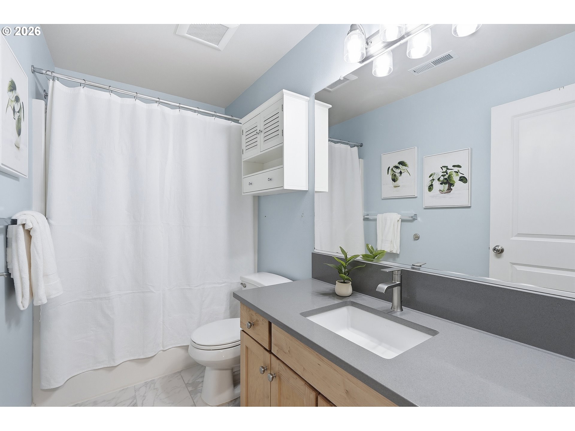 3307 North Terry Street Portland, OR 97217 - Photo 29 of 37 a bathroom with a granite countertop sink a toilet and a mirror