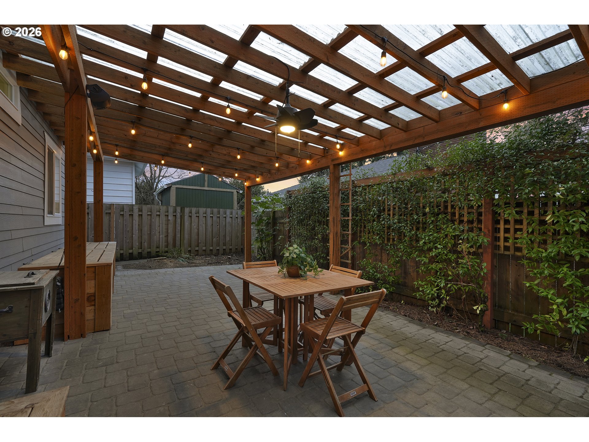 3307 North Terry Street Portland, OR 97217 - Photo 32 of 37 a patio with table and chairs with potted plants