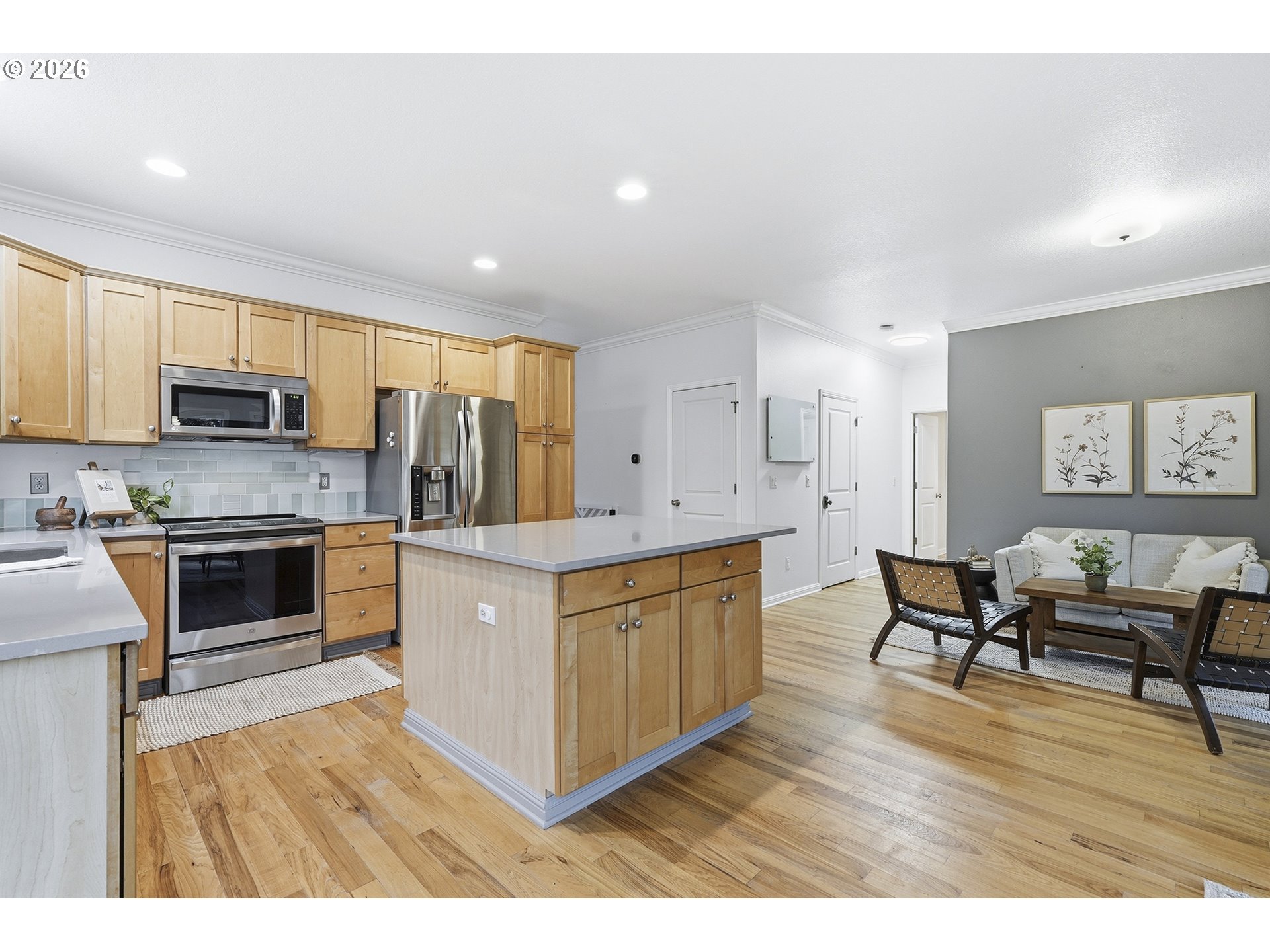 3307 North Terry Street Portland, OR 97217 - Photo 10 of 37 a kitchen with stainless steel appliances kitchen island granite countertop a stove top oven a sink a dining table and chairs