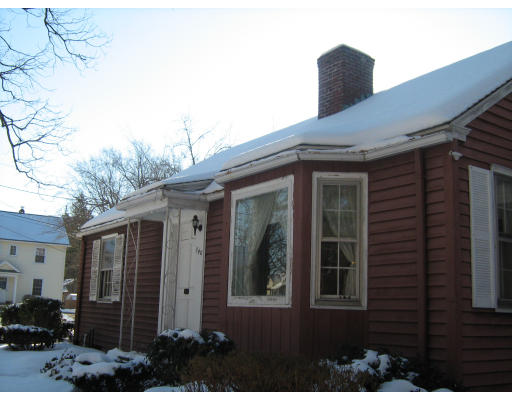 140 Manchester Terrace Springfield, MA 01108 - Photo 2 of 5 a front view of a house with a yard
