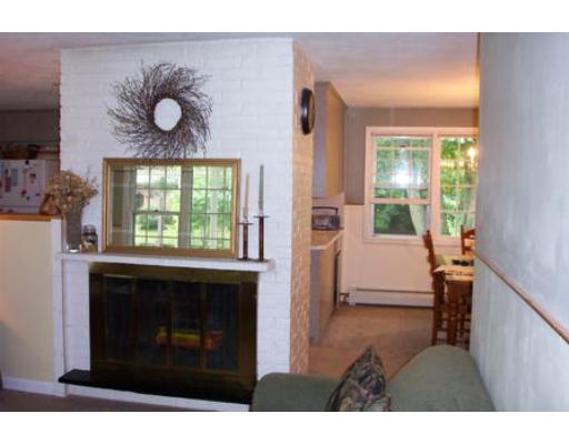83 Old Stage Road Chelmsford, MA 01824 - Photo 3 of 8 a living room with furniture and a fireplace