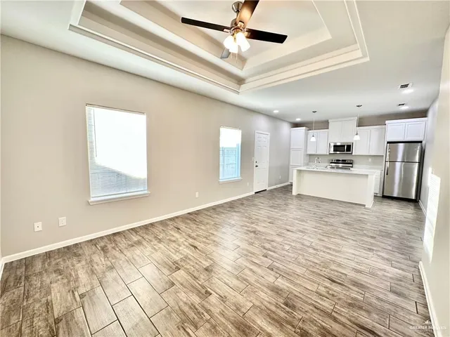 a view of a kitchen with electric appliances