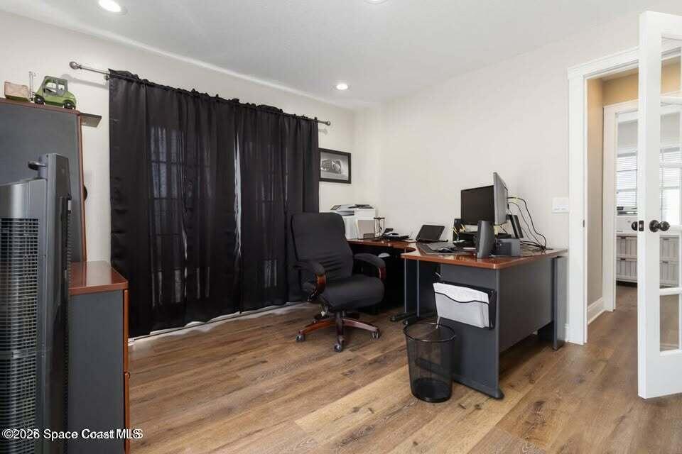 1280 Highway 1, Unit A Malabar, FL 32950 - Photo 11 of 20 a view of a workspace with furniture and wooden floor