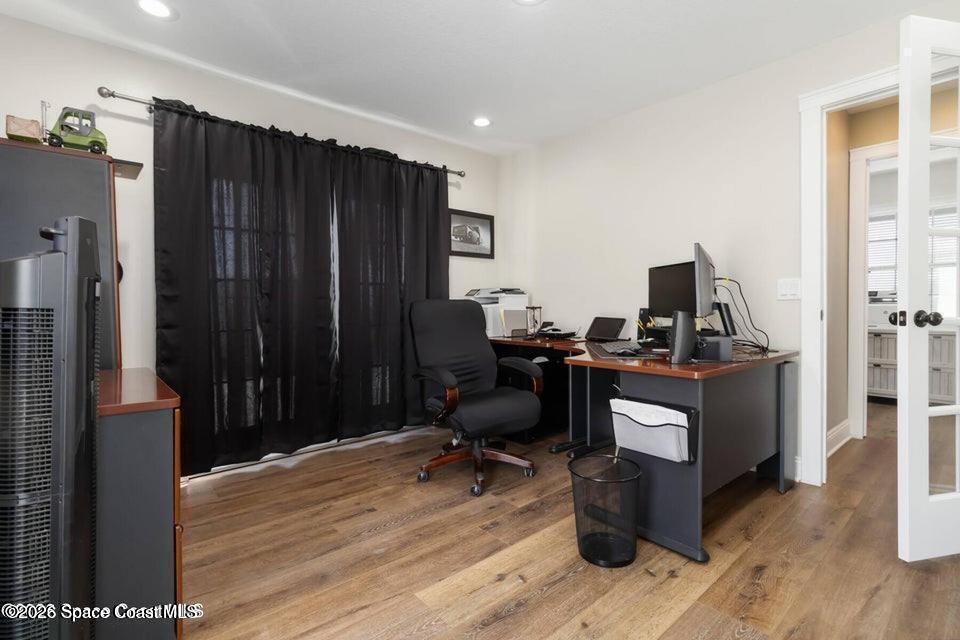 1280 Highway 1, Unit A Malabar, FL 32950 - Photo 11 of 26 a view of a workspace with furniture and wooden floor
