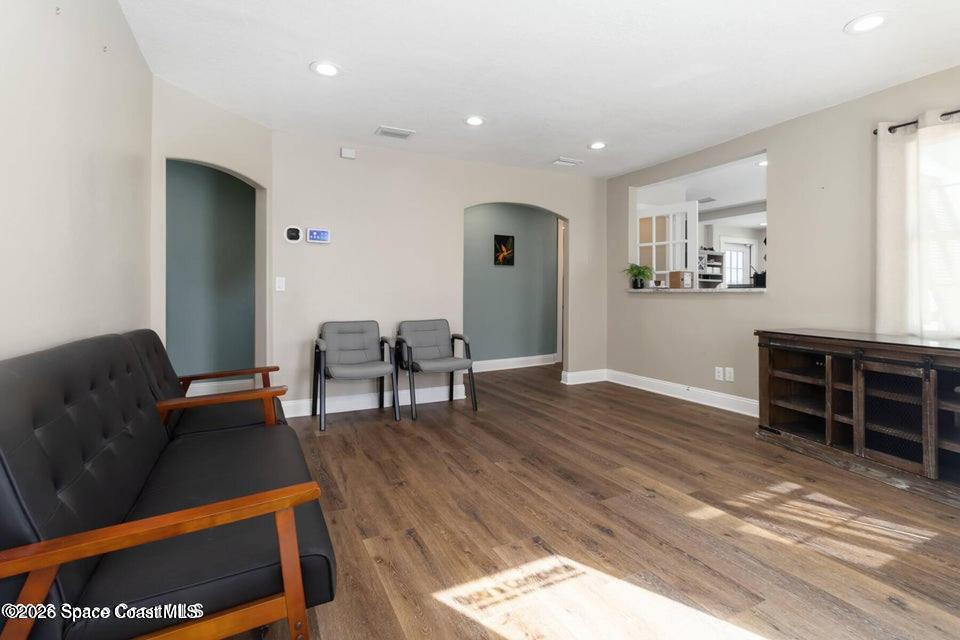 1280 Highway 1, Unit A Malabar, FL 32950 - Photo 3 of 26 a living room with furniture and wooden floor