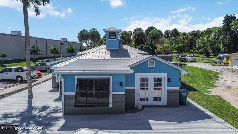 1280 Highway 1, Unit A Malabar, FL 32950 - Photo 4 of 20 a front view of a house with garden