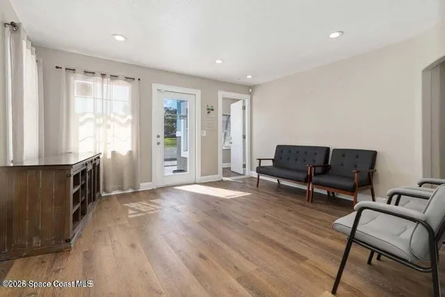 a living room with furniture and a window