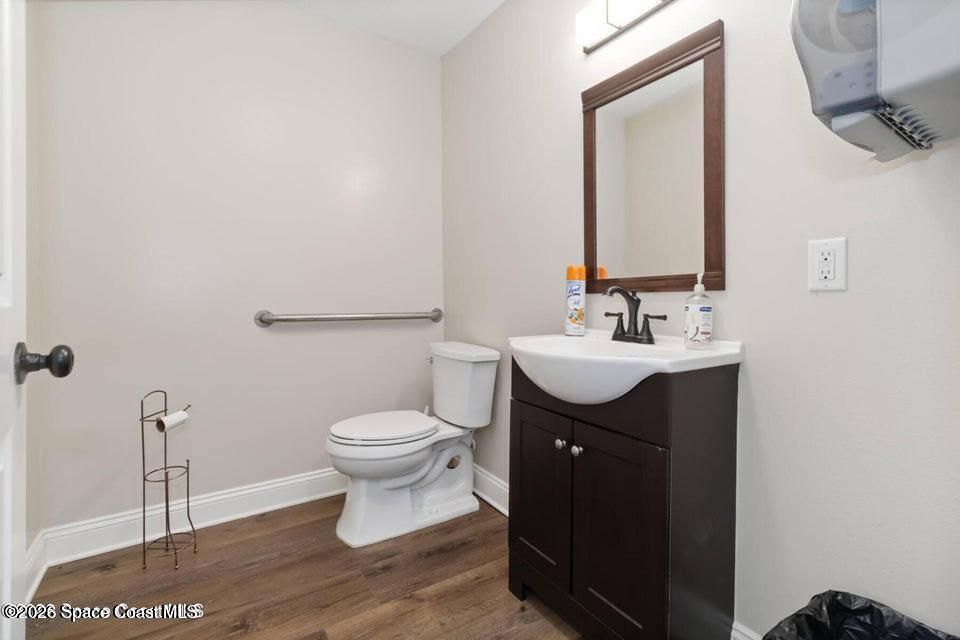1280 Highway 1, Unit A Malabar, FL 32950 - Photo 8 of 26 a bathroom with a sink toilet and a mirror