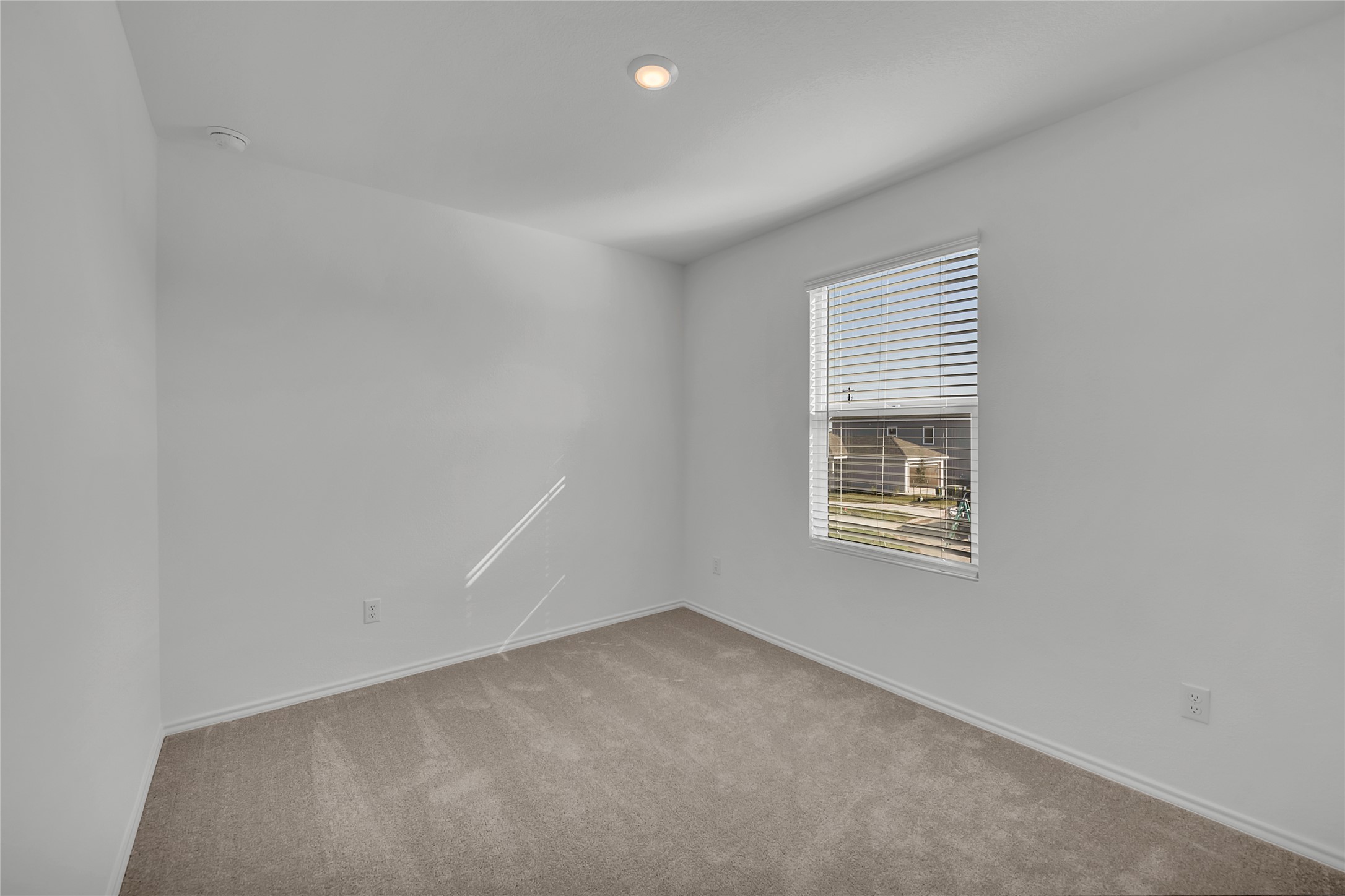 309 Marty Allen Loop Jarrell, TX 76537 - Photo 11 of 33 Bedroom featuring light gray carpeting and bright white walls