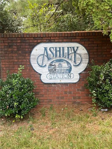 a view of outdoor space with signage and flags