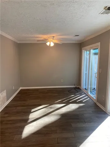 a view of room with wooden floor