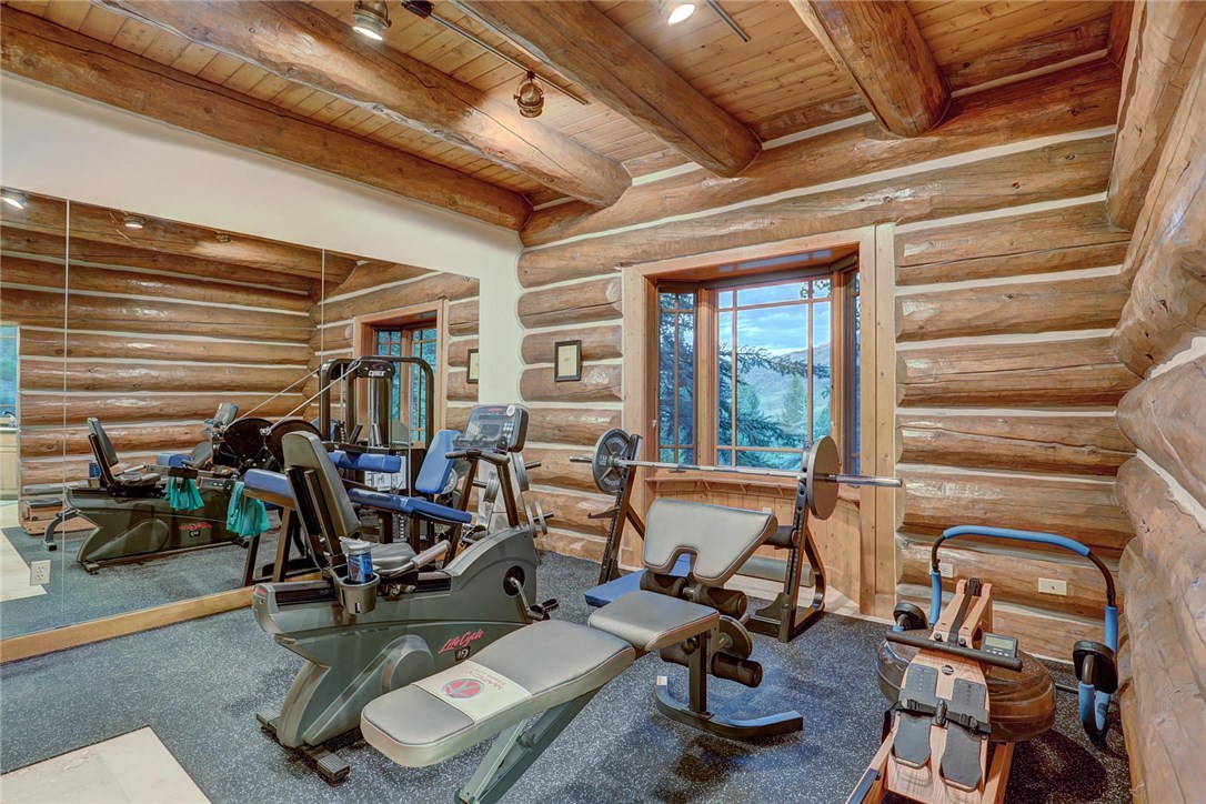 1381 Johnson Road Silverthorne, CO 80498 - Photo 19 of 35 The last part of the master bedroom is the gym. Complete with weight room flooring, a wall of mirrors, and even a sauna! Enter the gym from either the master bathroom/laundry or hallway leading to master bedroom.