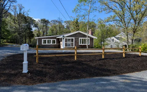a house with trees in the background