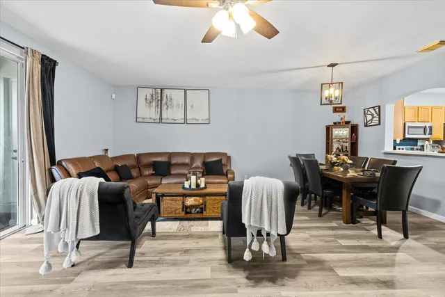 a view of a livingroom with furniture and a window