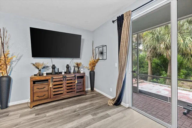 a room with furniture and a flat screen tv