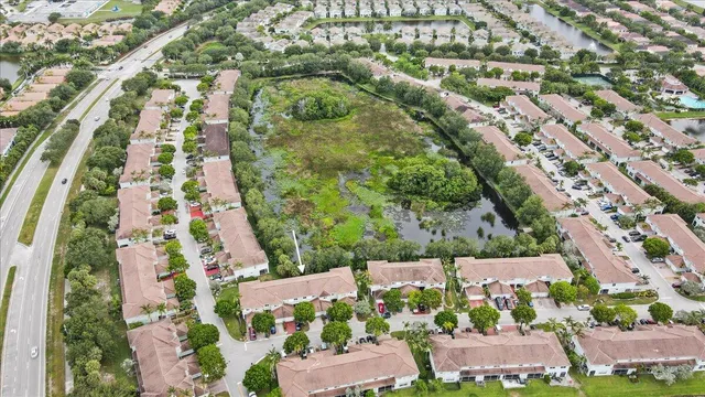 an aerial view of residential houses with outdoor space