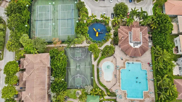an aerial view of residential house with outdoor space and swimming pool