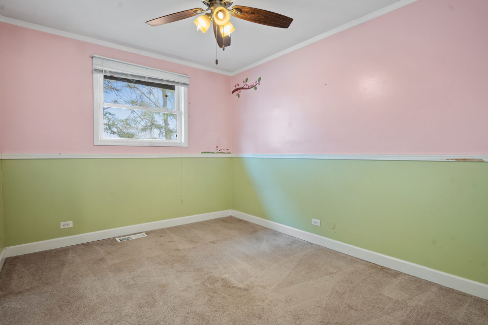 531 Silverleaf Boulevard Carol Stream, IL 60188 - Photo 16 of 25 an empty room with a window and a fan