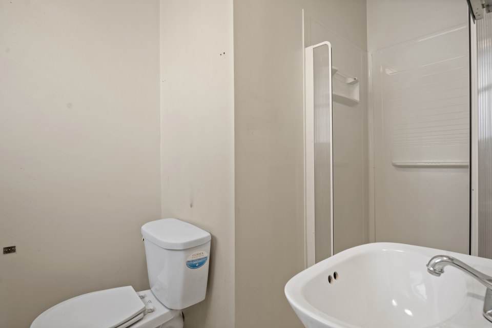 531 Silverleaf Boulevard Carol Stream, IL 60188 - Photo 21 of 25 a white toilet sitting next to a bathroom sink