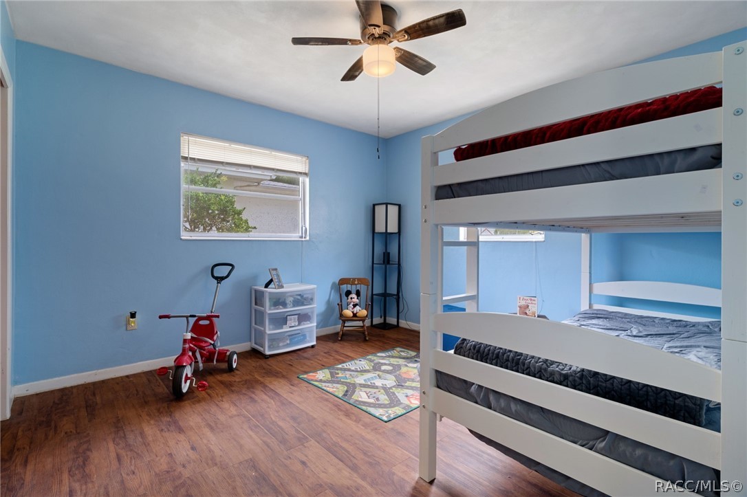 3355 South Highlands Avenue Inverness, FL 34452 - Photo 21 of 30 a bedroom with furniture and a window