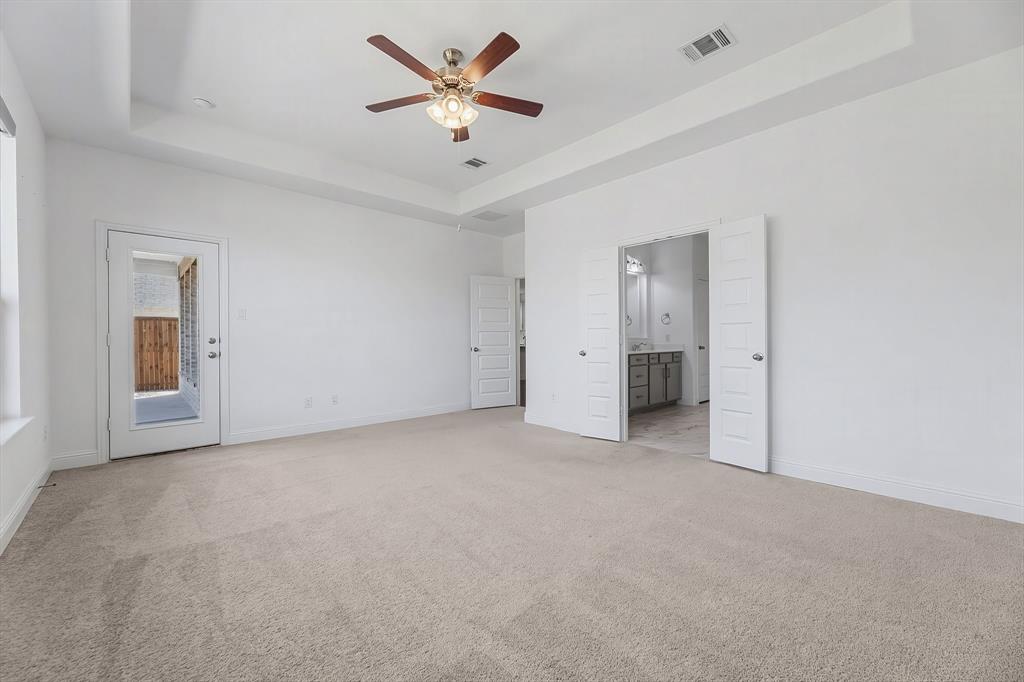 3120 Stonelake Ridge Lewisville, TX 75010 - Photo 14 of 40 an empty room with a ceiling fan and a window