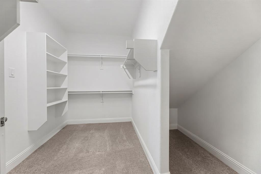 3120 Stonelake Ridge Lewisville, TX 75010 - Photo 19 of 40 a view of walk in closet with empty racks
