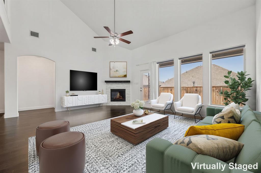 3120 Stonelake Ridge Lewisville, TX 75010 - Photo 2 of 40 a living room with furniture and a flat screen tv