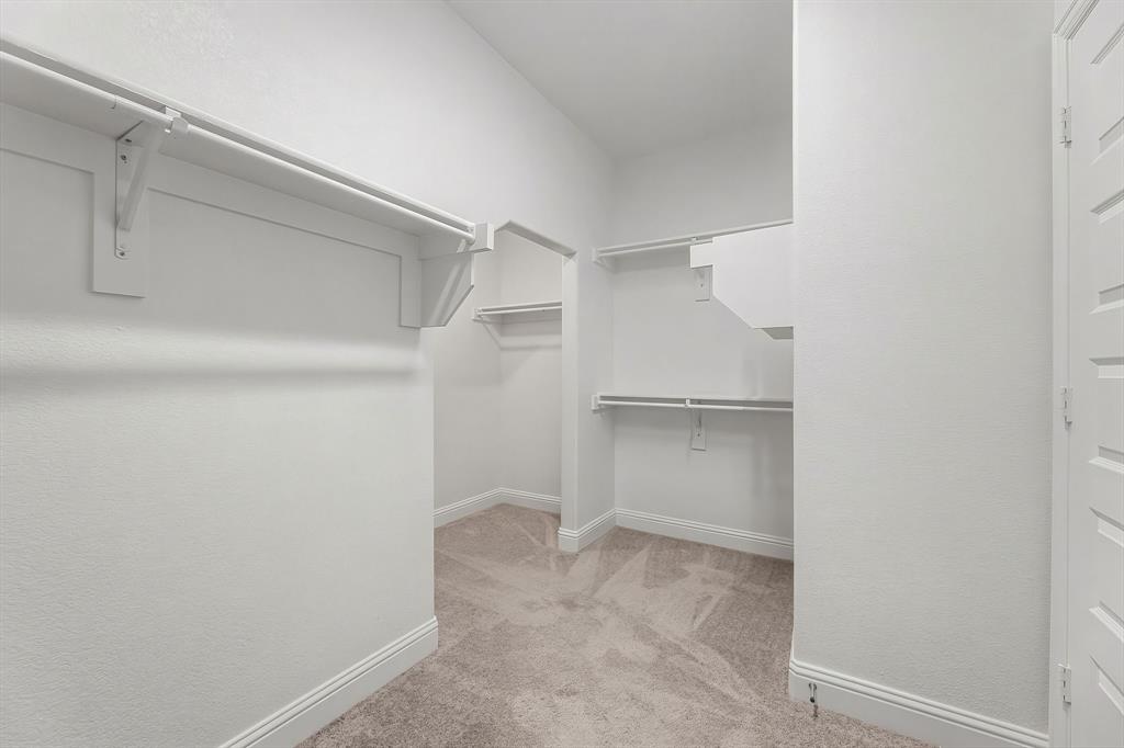 3120 Stonelake Ridge Lewisville, TX 75010 - Photo 20 of 40 a view of an empty walk in closet