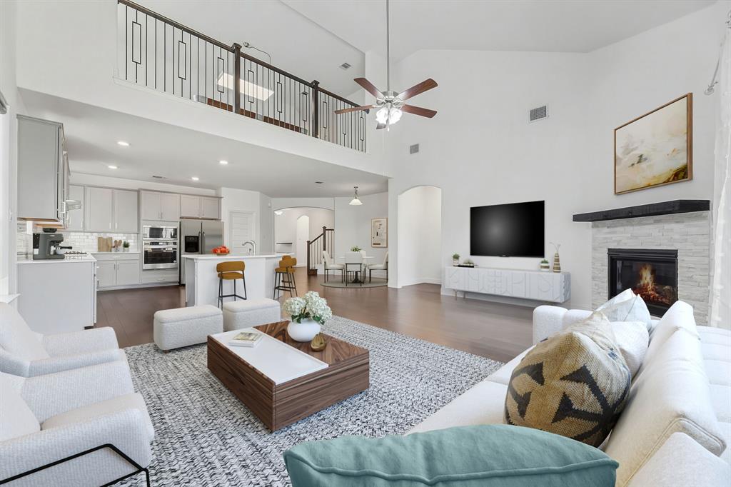 3120 Stonelake Ridge Lewisville, TX 75010 - Photo 6 of 40 a living room with furniture kitchen view and a flat screen tv