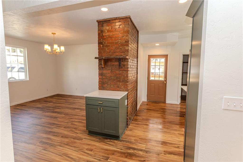325 Laughlin Street Dawson, PA 15428 - Photo 12 of 34 a view of an empty room with window and wooden floor