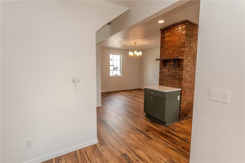 325 Laughlin Street Dawson, PA 15428 - Photo 14 of 34 a view of a hallway with wooden floor and staircase