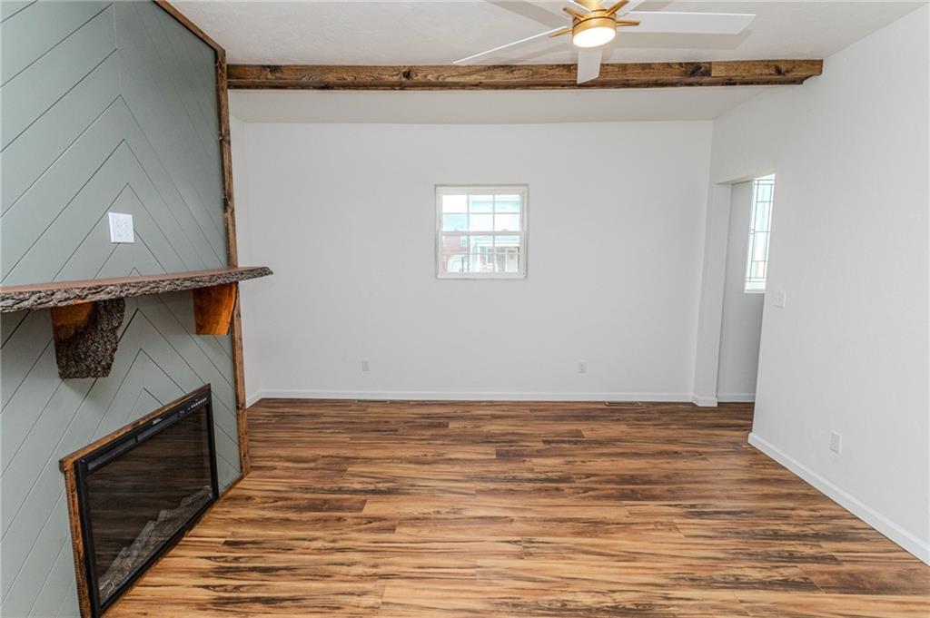 325 Laughlin Street Dawson, PA 15428 - Photo 18 of 34 a view of a livingroom with an empty space and a fireplace