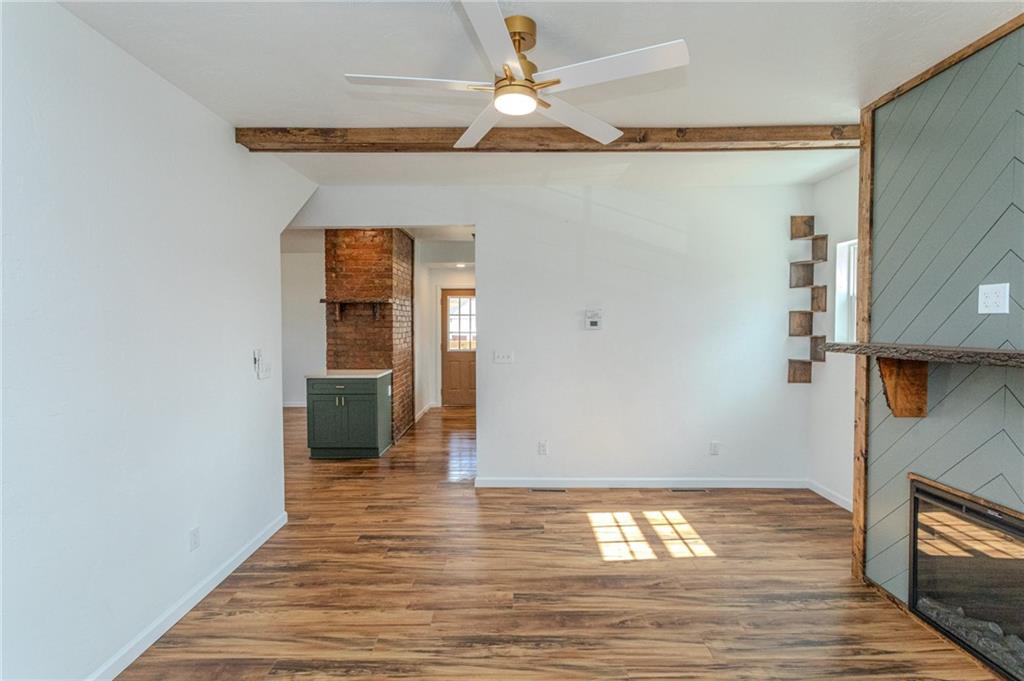 325 Laughlin Street Dawson, PA 15428 - Photo 21 of 34 a view of an empty room with wooden floor and a window
