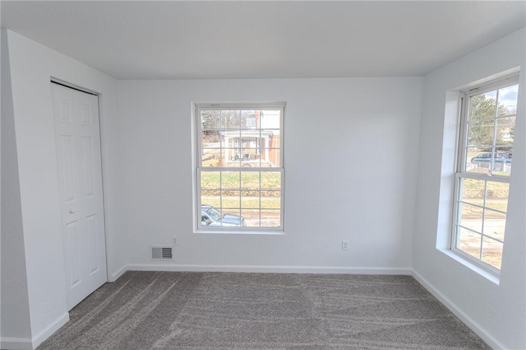 325 Laughlin Street Dawson, PA 15428 - Photo 23 of 34 an empty room with windows