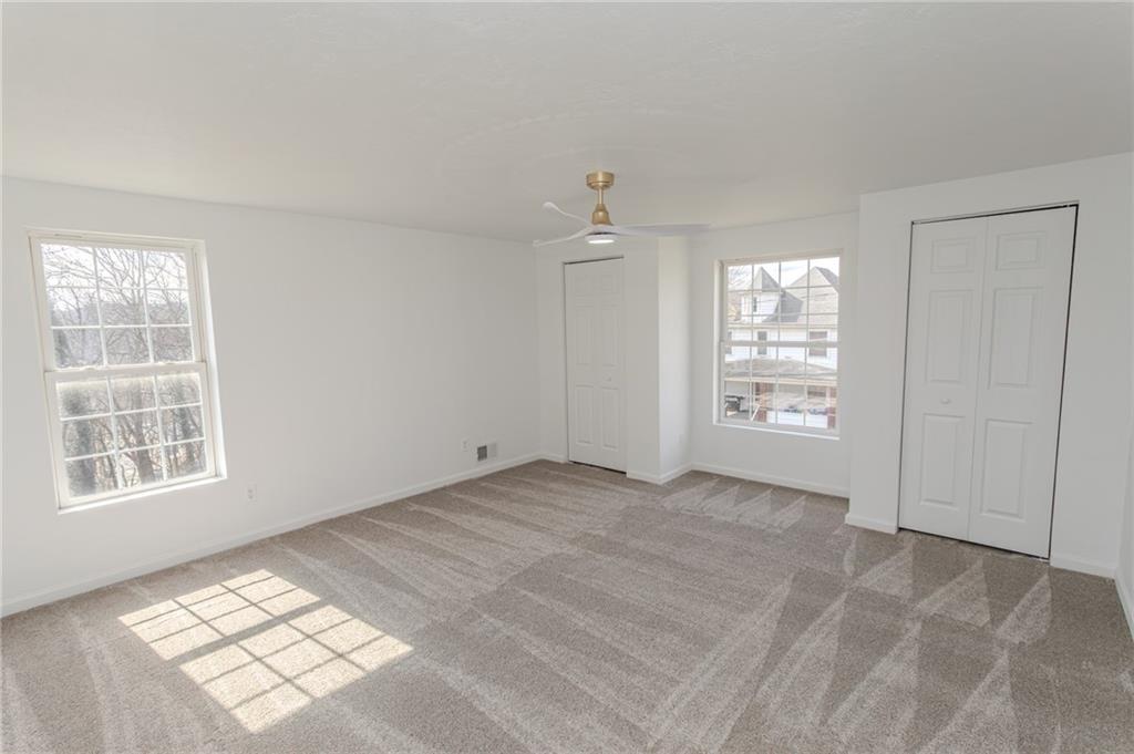 325 Laughlin Street Dawson, PA 15428 - Photo 25 of 34 an empty room with windows and closet