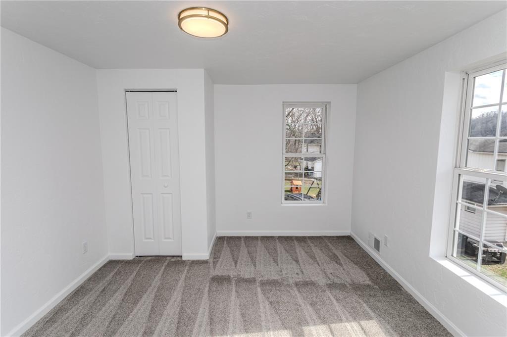 325 Laughlin Street Dawson, PA 15428 - Photo 27 of 34 an empty room with windows