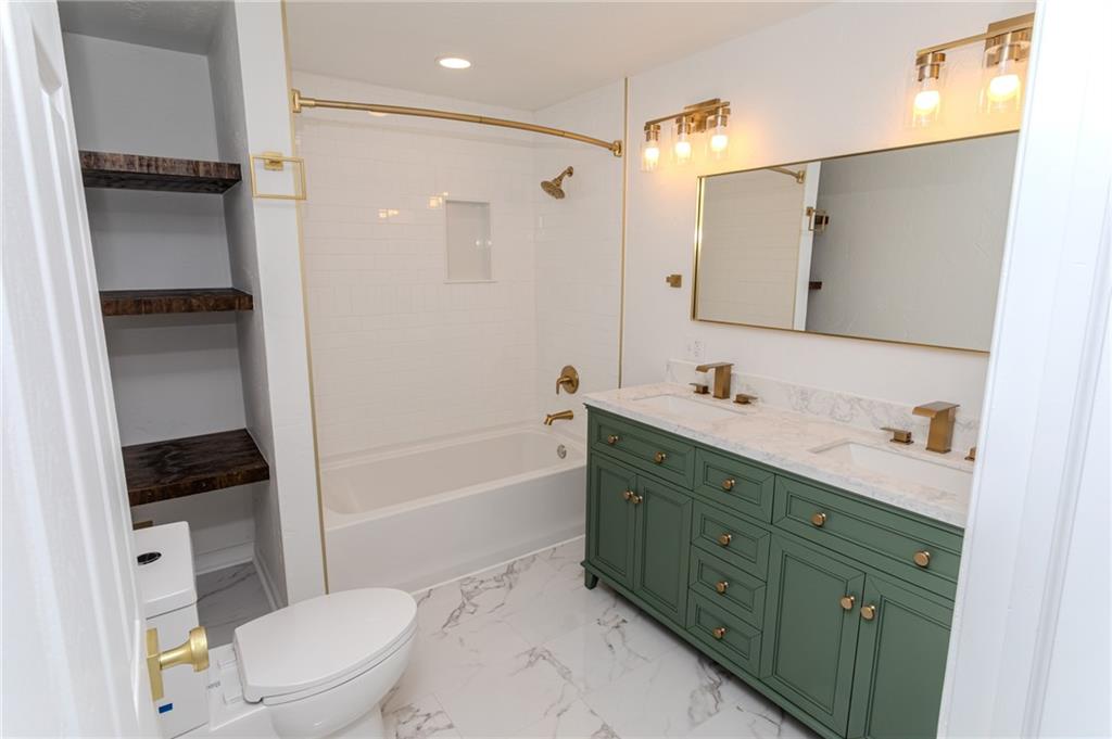 325 Laughlin Street Dawson, PA 15428 - Photo 29 of 34 a bathroom with a sink a toilet and shower
