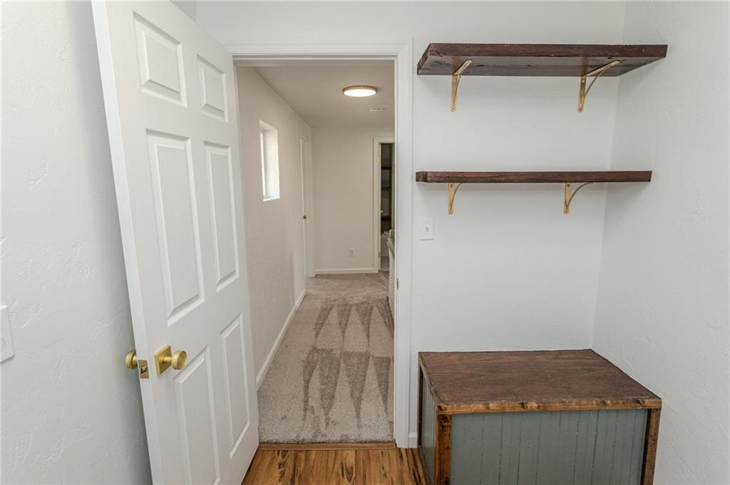 325 Laughlin Street Dawson, PA 15428 - Photo 30 of 34 a view of a room with wooden floor and staircase
