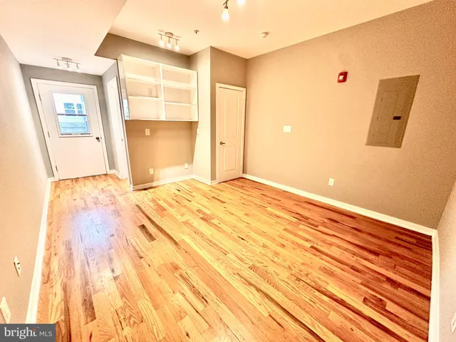 a view of an empty room with a window