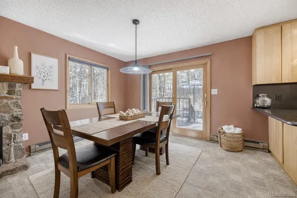 a view of a dining room with furniture window and outside view