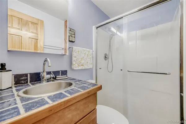 a bathroom with a sink and mirror