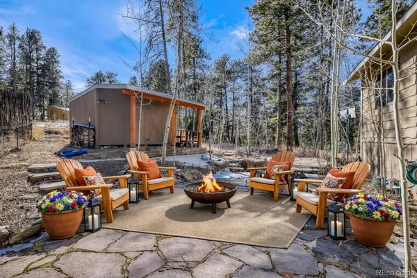 a view of a patio with fire pit