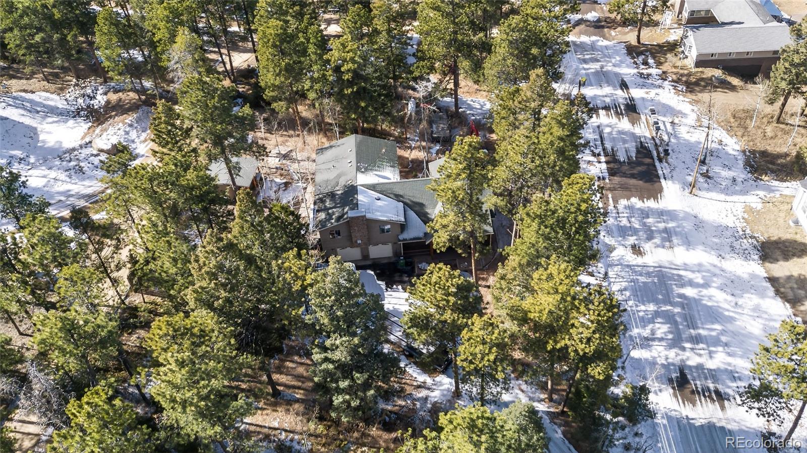 26196 Rea Avenue Conifer, CO 80433 - Photo 33 of 46 a view of a house with a tree
