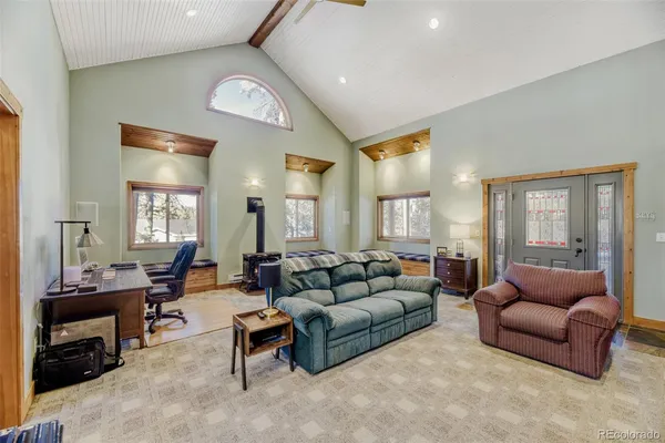 a living room with furniture or couch and a window