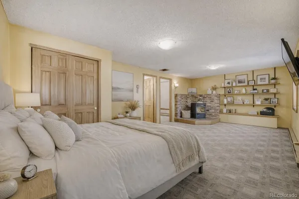 a bed room with a bed and a large closet